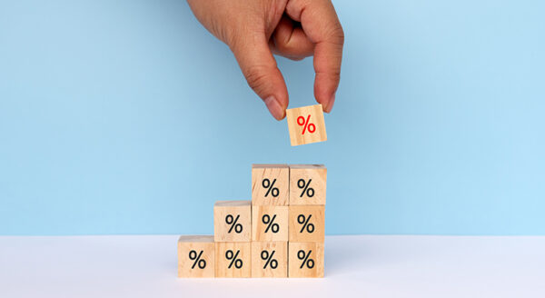 hand picking cubes with percentage signs